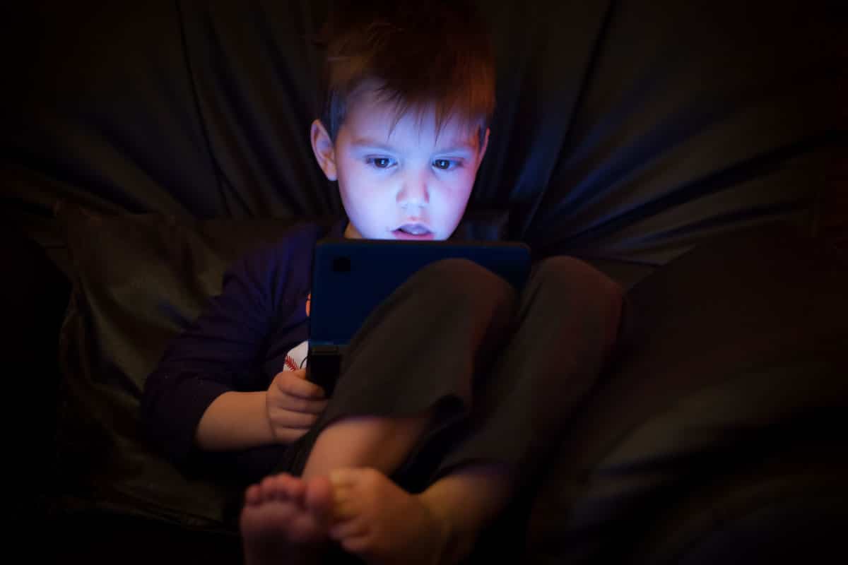 child captivated by technology