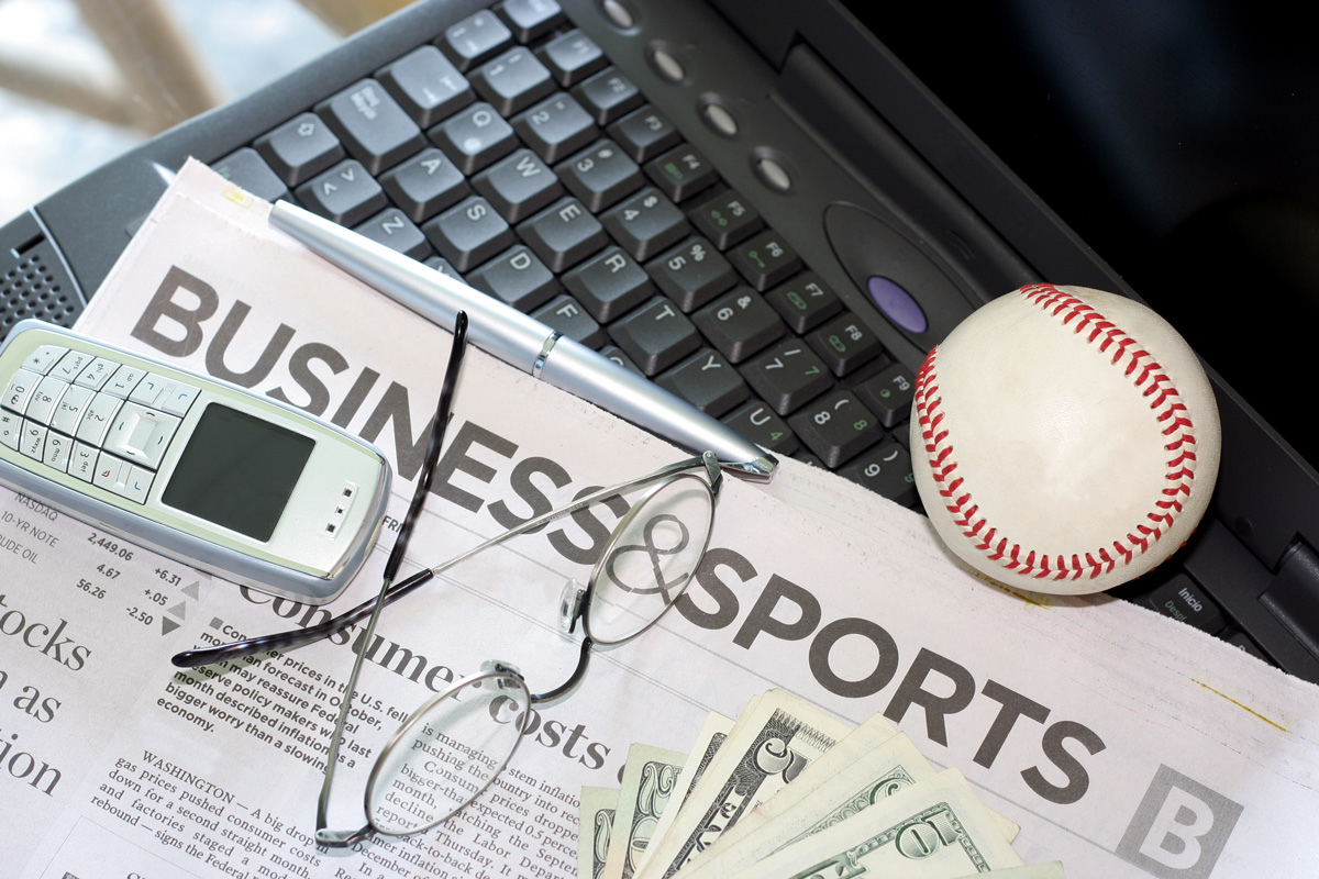 Newpaper with the headline of Business and Sports