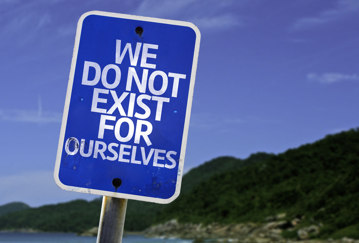 blue road sign that says We Do Not Exist For Ourselves